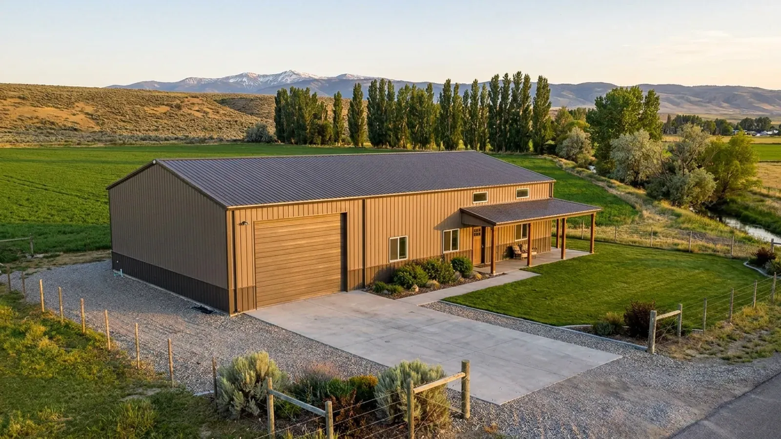 A barndominium with a tall, deep RV garage bay attached to the residence under one continuous roof.